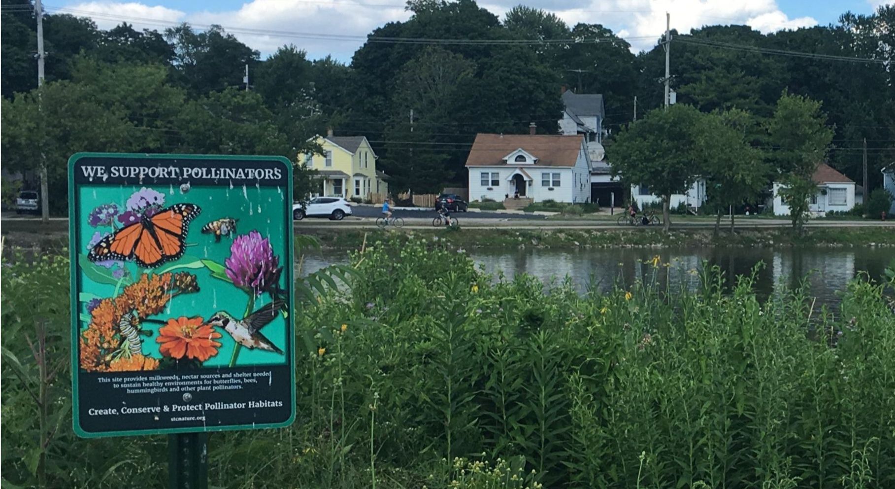 We support pollinators sign by river